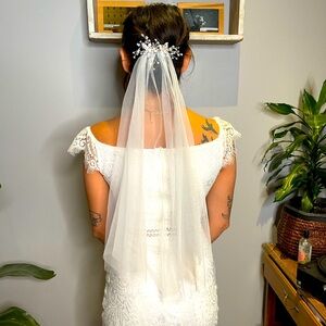 Shoulder length veil with rhinestone hair piece